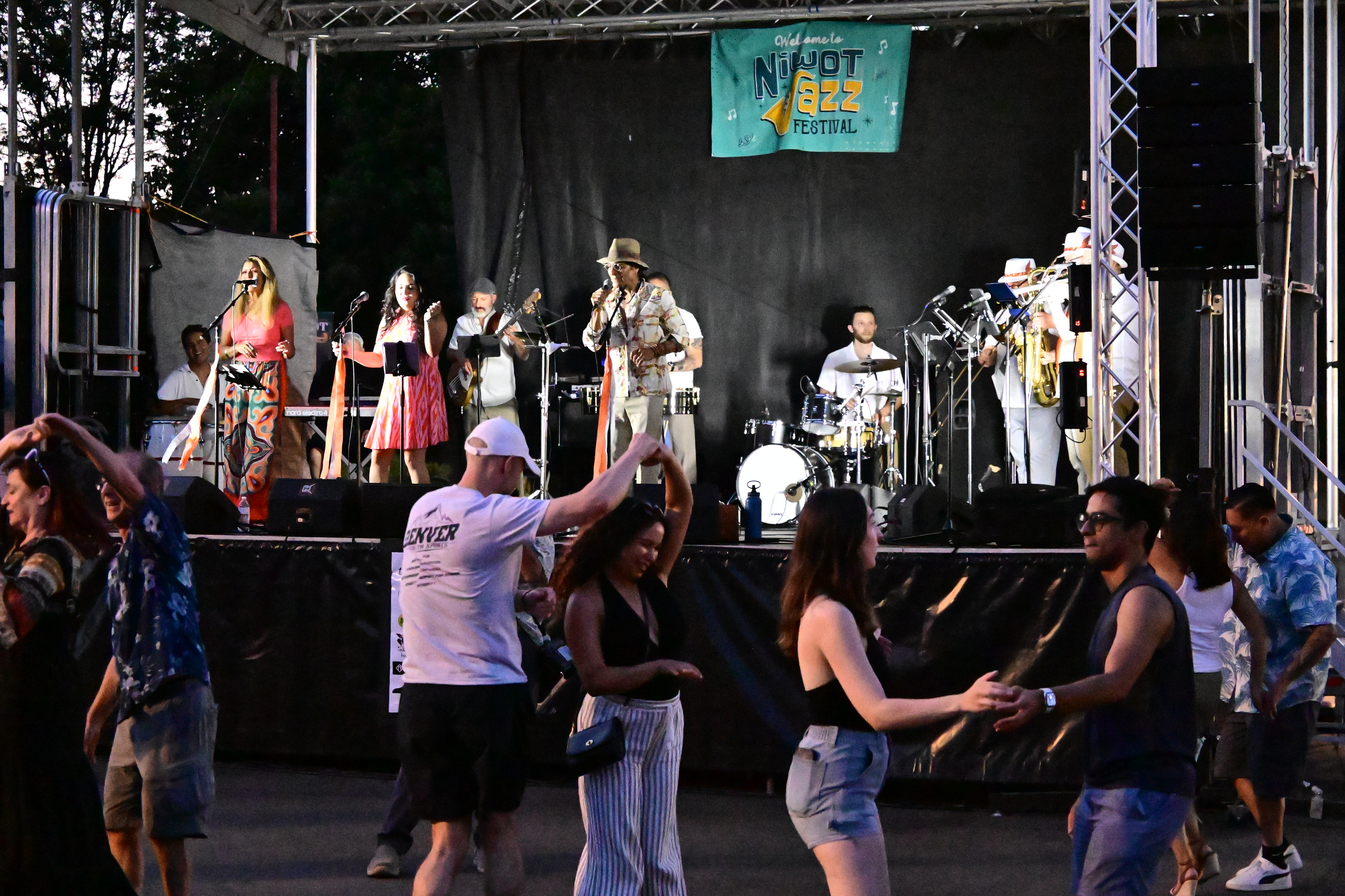 Quemando Performance and dancers at dusk at the Niwot 2025 Jazz Festival